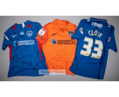 Three signed Portsmouth FC jersey's,comprising Callum Johnson orange no.2 third choice jersey, season 2020-21, short-sleeved 