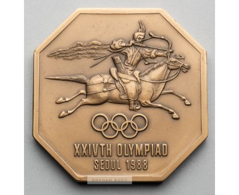 Seoul 1988 Olympic Games volunteer's participation medal,bronze octagonal, obverse depicting a horseman shooting an arrow abo