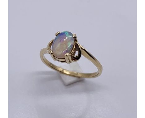 A 14ct gold ring set with an opal