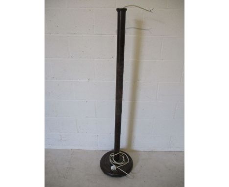 An Oriental hand carved standard lamp
