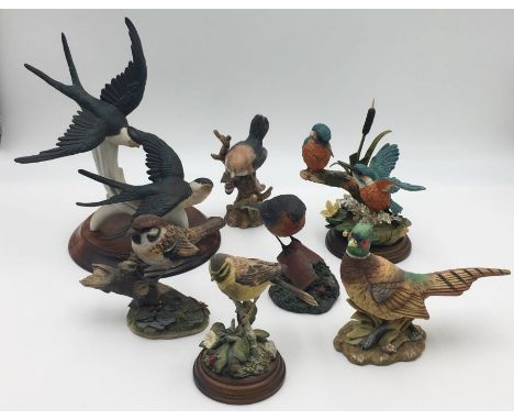 A collection of ceramic birds including a Karl Ens pair of swallows, country artists etc.