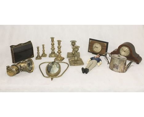 An assortment of items including brassware, mantle clocks, a vintage ladies handbag with tortoiseshell effect and compact mir