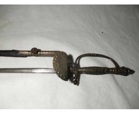 A late 19th or early 20th century dress rapier with trefoil blade, the cross guard and grip with cut steel decoration, scabba