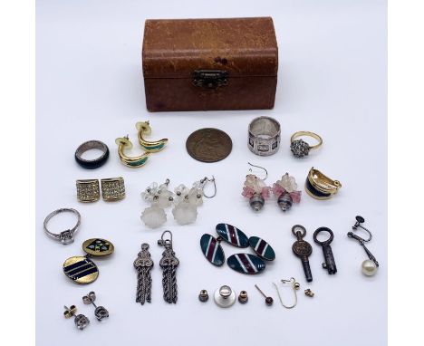 A small quantity of silver and costume jewellery in a leather Harrods casket style box