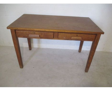 A vintage oak table with two drawers under.