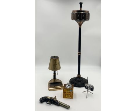 A small collection of smoking paraphernalia including table lighter in the form of a camera KKW Peace Gas,  two telescopic ci