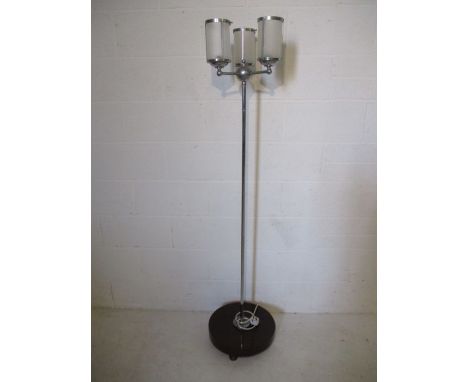 An Art Deco floor lamp with frosted light shades
