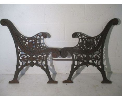 A pair of cast iron bench ends.