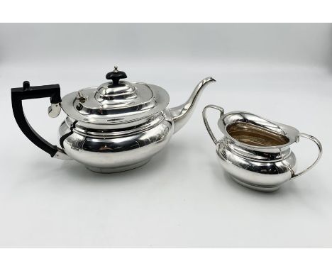 A hallmarked silver tea pot with matching sugar bowl ( Sheffield 1994) total weight 957.2g