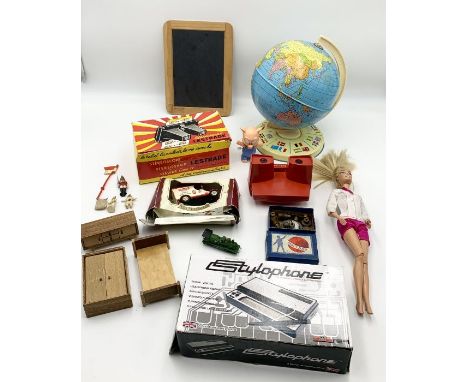 A small collection of vintage toys including a Chad Valley tin globe with flags to base, a Lestrade stereoscope, Stylophone, 