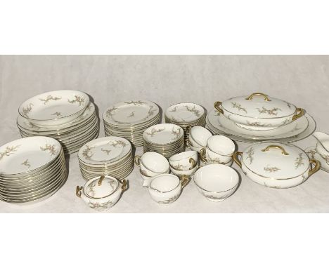  A comprehensive Limoges part dinner service comprising of dinner plates, side plates, tea cups, saucers, meat platters, ture