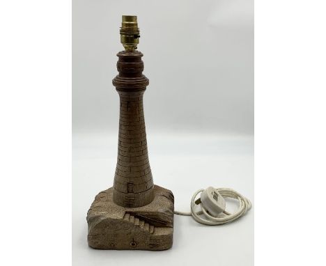 A wooden table lamp in the form of a lighthouse