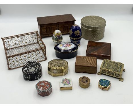 A collection of wooden and ceramic small boxes
