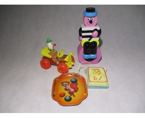 A vintage Fisher Price "Jalopy" pull along toy, along with Fisher Price Music Box Pocket Radio, Bertie Bassett money box and 