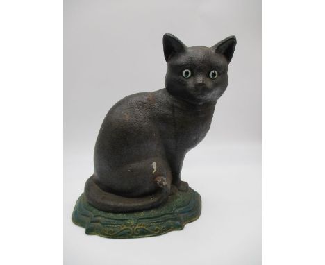 A vintage cast iron door stop in the form of a cat - overall height approx. 31cm