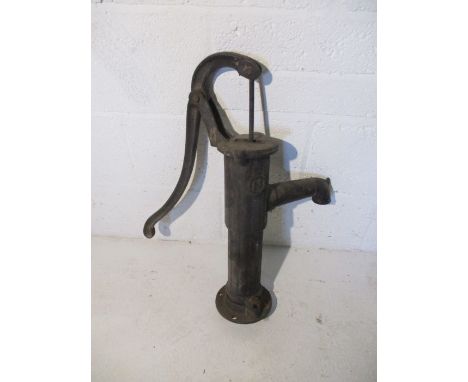 A vintage cast iron water pump