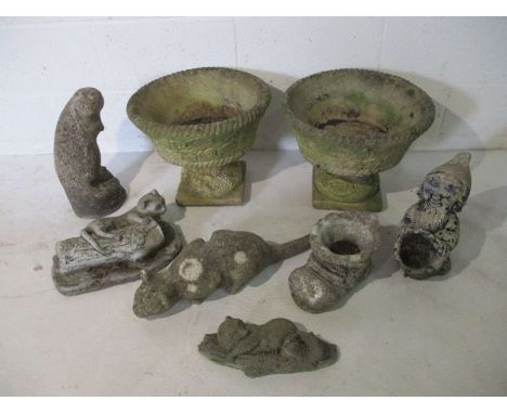 A pair of concrete garden pots on plinths, along with a collection of various concrete garden ornaments including a gnome, ca