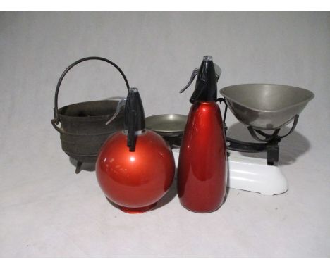 Two vintage red Sparklets Globemaster siphons, along with a set of Avery scales and cast iron cauldron 