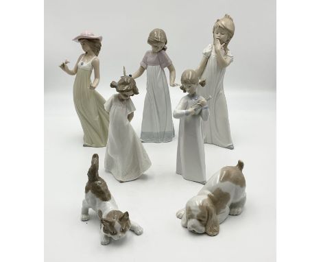 A collection of Lladro and Nao figurines