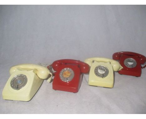 Four vintage dial telephones, two red and two cream