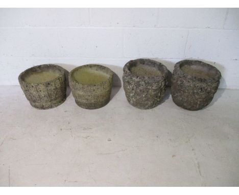 Two pairs of concrete garden pots