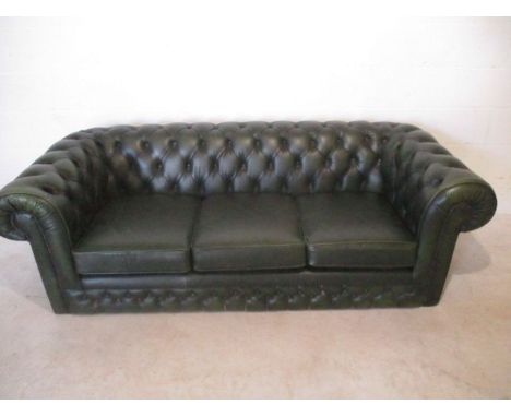 A Thomas Lloyd three seater green Chesterfield button back sofa 