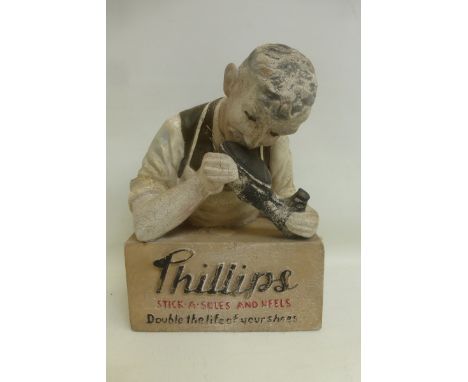 A "Phillips Stick-A-Soles and Heels" rubberoid shop window advertising figure.