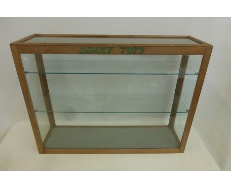 DINKY TOYS - a genuine 32" oak and glass dealership display cabinet with two shelves.