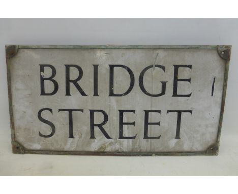 A rectangular enamel/street sign for "Bridge Street", 24 3/4 x 12 3/4".
