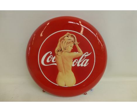 A Coca Cola red enamel circular sign, by Mel Ramos (USA artist), with advertising figure of Ursula Andress.