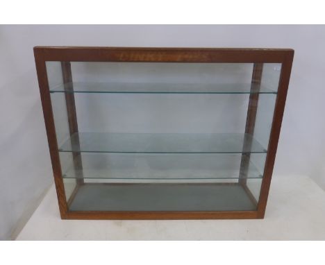 DINKY TOYS - a genuine 30" oak and glass dealership display cabinet with three shelves.