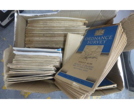 A small box of early Ordnance Survey maps.