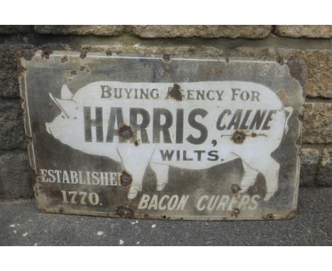 An early Harris of Calne, Wilts. pictorial rectangular enamel sign, depicting a pig in side profile, faded, 30 x 18".