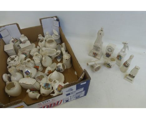 An assortment of crestedware of various ages and styles including Grafton china, Carlton china, Corona china, W.H. Goss, Swan