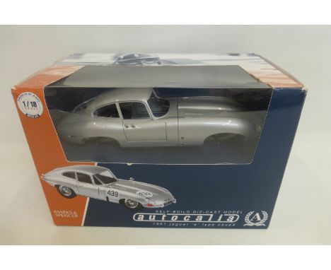 A boxed Burago Jaguar E Type self build kit, 1:18th scale.