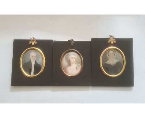 Pair of portrait miniatures on ivory, oval, head and shoulders portraits of a lady and gentleman, 7cm x 6cm, mounted in black