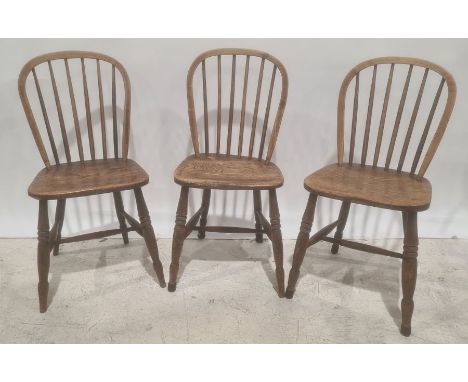 Three elm seated stick-back chairs and one further armchair (4)