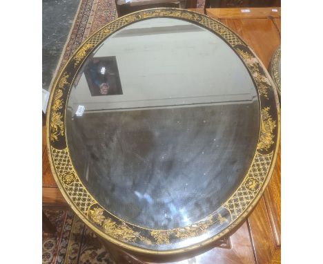 Oval bevel edged mirror in chinoiserie black ground frame with various figures together with one further circular mirror (2)