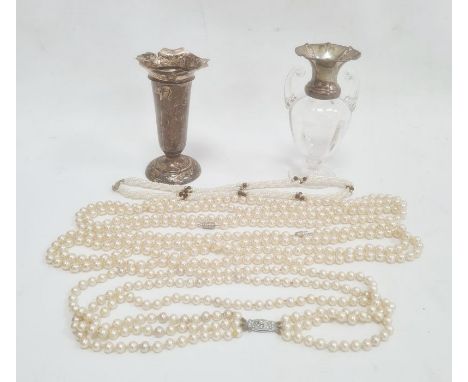 Early 20th century glass and silver-mounted two-handled miniature vase with flared silver rim, scroll handles, on circular ba