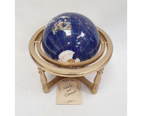 220mm gemstone globe in rotating cradle, with four sculptured legs and central compass 