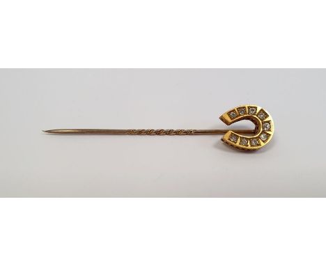 Victorian gold-coloured stickpin with horseshoe finial, set with nine diamonds, marked 15
