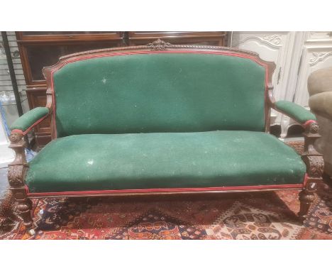 Victorian sofa mahogany frame, green upholstered seat back and armrests, turned and fluted front legs to white china castors&