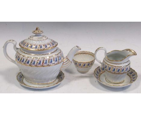 A Worcester Flight Barr &amp; Flight teapot, cover and stand, tea bowl and saucer and cream mug, of spirally moulded form, pa