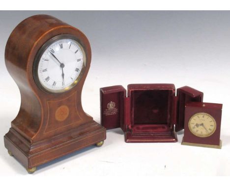 An Edwardian balloon shaped mantle clock and a Looping 15 jewel miniature travelling clock in a case