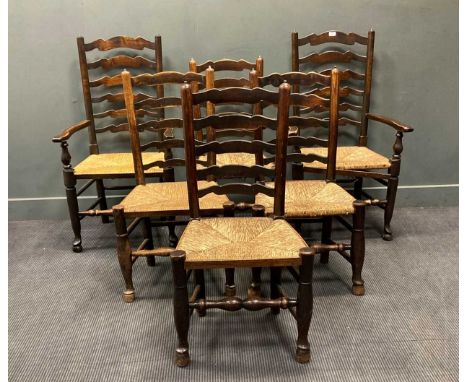 A set of four 19th century ladder-back dining chairs with rush seats together with two later ladder back armchairs, a spindle
