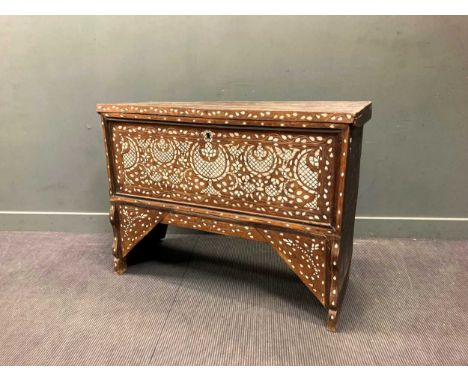 An Eastern mother of pearl inlaid chest with rectangular hinged lid, the front panel decorated with inlaid birds and foliage,