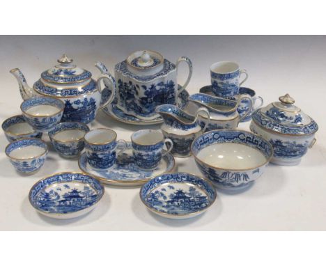 A collection of Newhall blue and white 'Two Moth' pattern teawares, comprising a teapot, cover and stand, a teapot and cover,