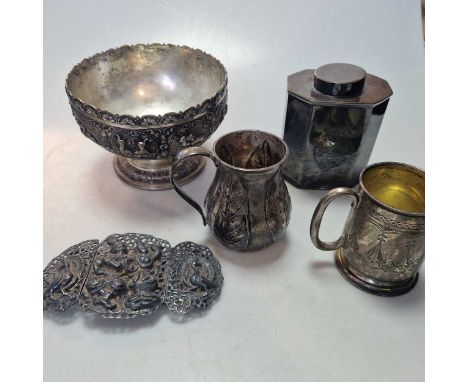 Two silver christening cups and an unmarked tea caddy, tests as silver, 18.7ozt gross, together with an Indian metalwares bow