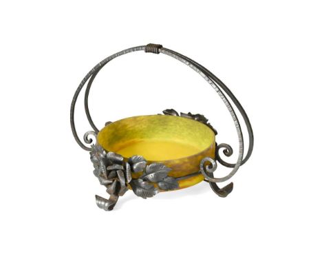 Degue, an Art Deco mounted glass and wrought iron centrepiece, the pâte de verre glass bowl in mottled yellow and set within 