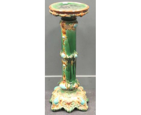 An early 20th century ceramic jardiniere 88cm high 32cm diameter
